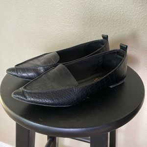 Black slip on flats with animal print leather like material